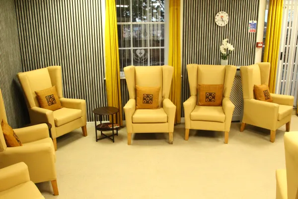 Welcoming lounge with wingback chairs at Chestnut Rise Nursing Home private nursing home in Rossington